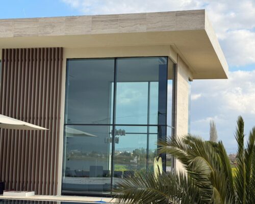Minimal aluminium frames and Alumil Smartia M7 curtain wall corner construction in contemporary private residence