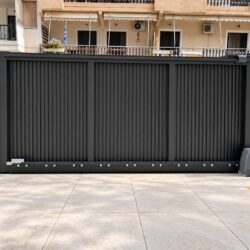 Automatic anthracite aluminium sliding garage gate TR55 with motor and vertical profiles