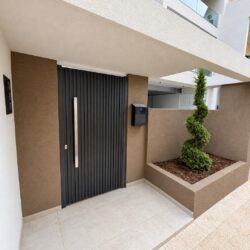 Modern residential entrance with anthracite aluminium pedestrian gate TR55